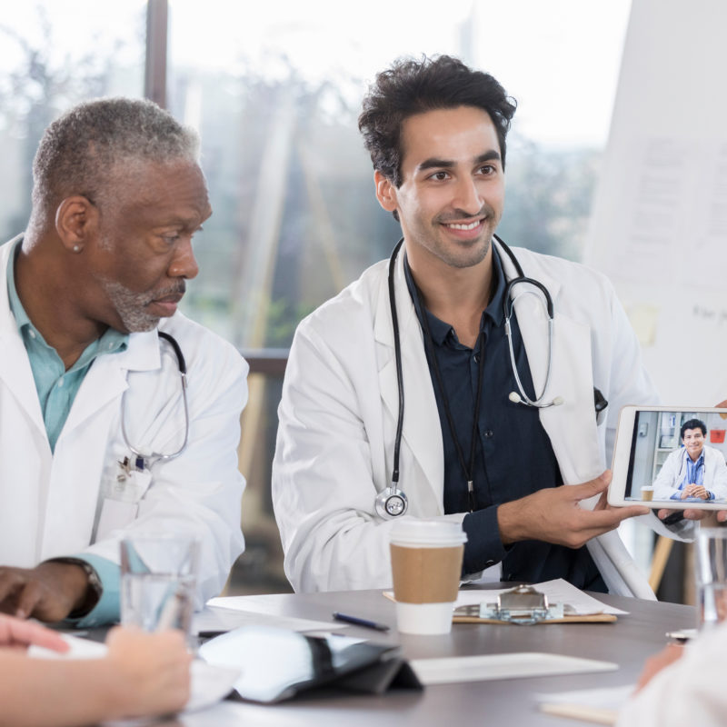 Doctors video conference with a colleague